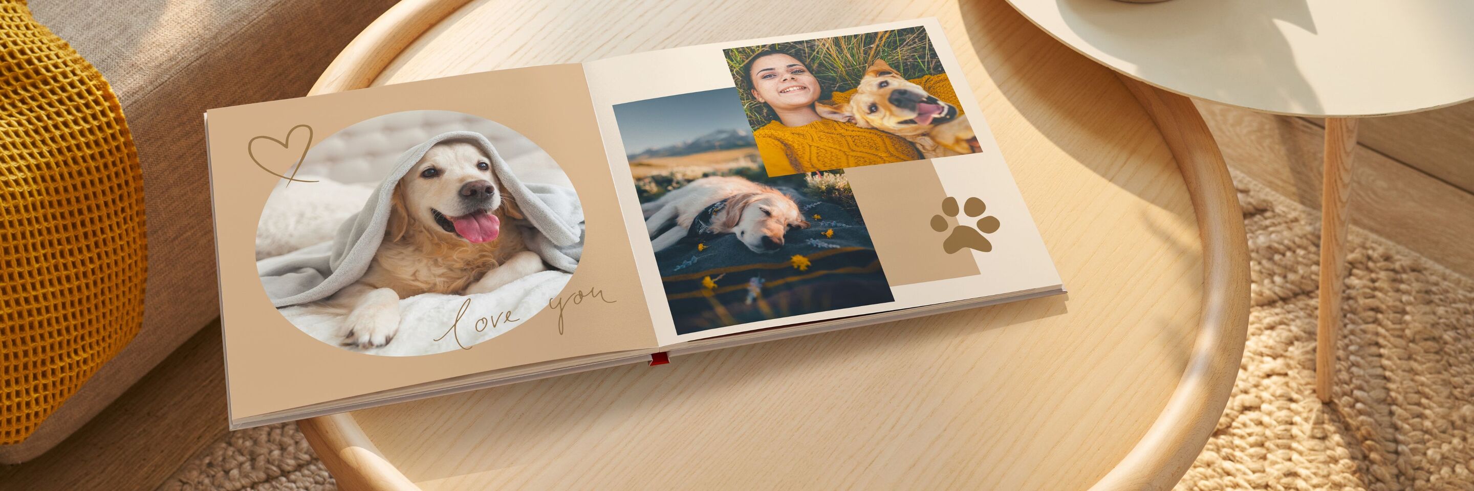 CEWE fotokniha s obrázkami psa, ženy a prírody na stole.